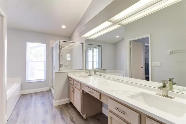 a bathroom with a granite countertop sink mirror and double