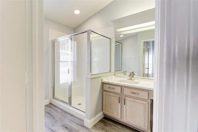 a bathroom with a granite countertop sink a mirror and a