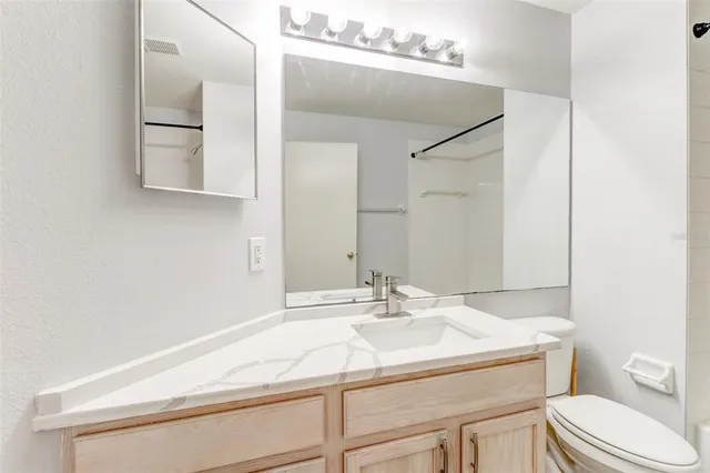 a bathroom with a sink and a toilet