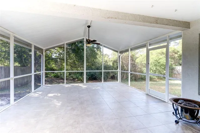 a view of an empty room with windows