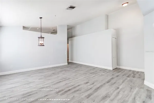 a view of a storage & utility room with wooden floor