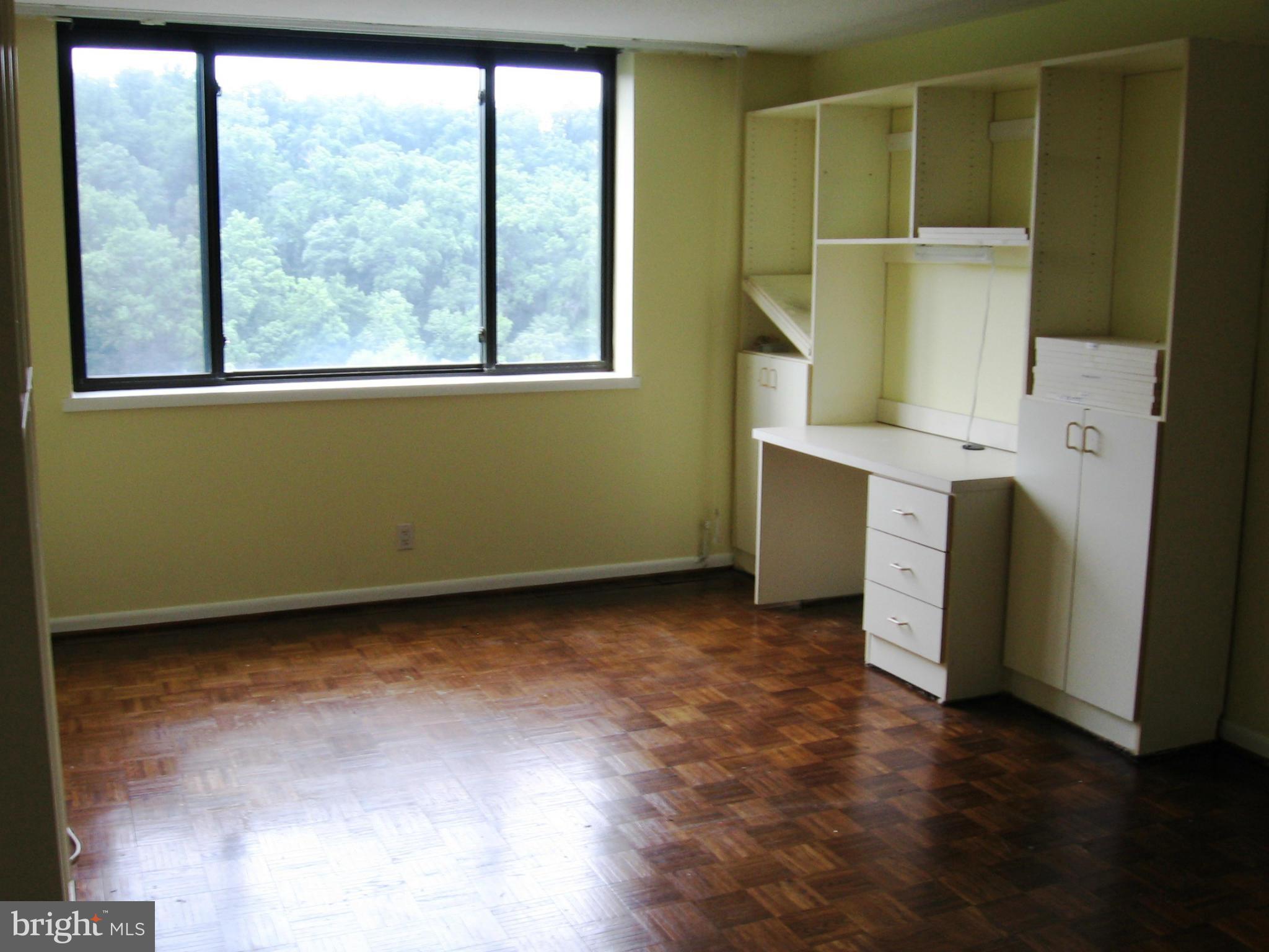 111 Hamlet Hill Road, Unit 1304 Baltimore, MD 21210 - Photo 11 of 17 an empty room with a window