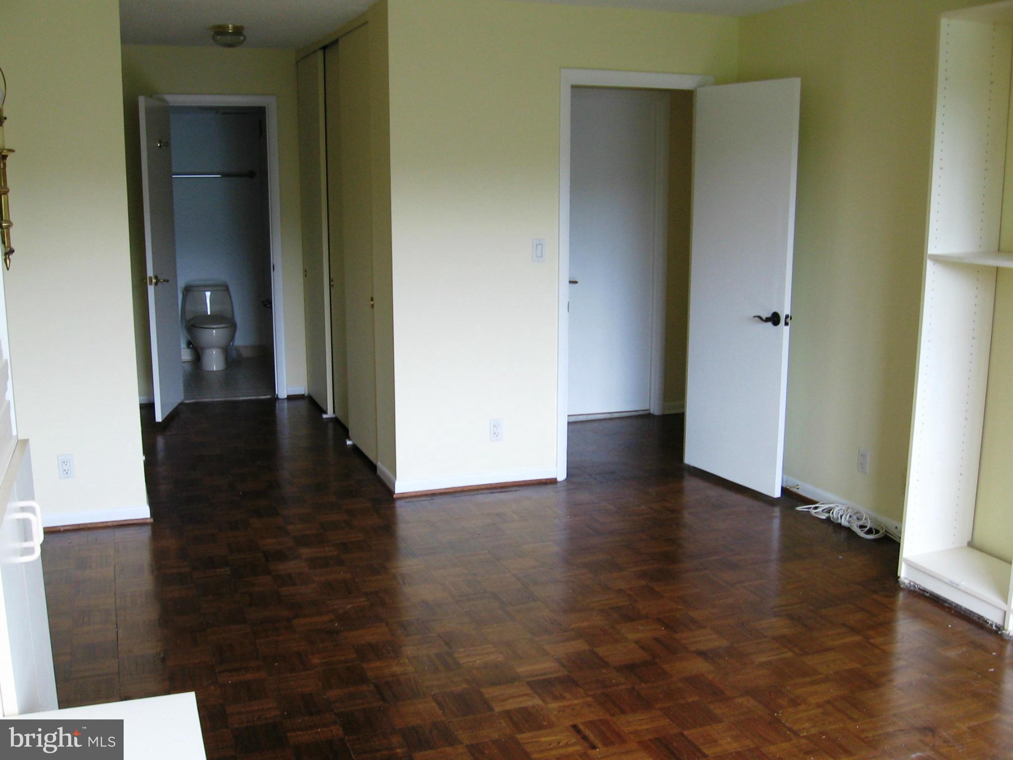 111 Hamlet Hill Road, Unit 1304 Baltimore, MD 21210 - Photo 12 of 17 a view of a hallway with wooden floor