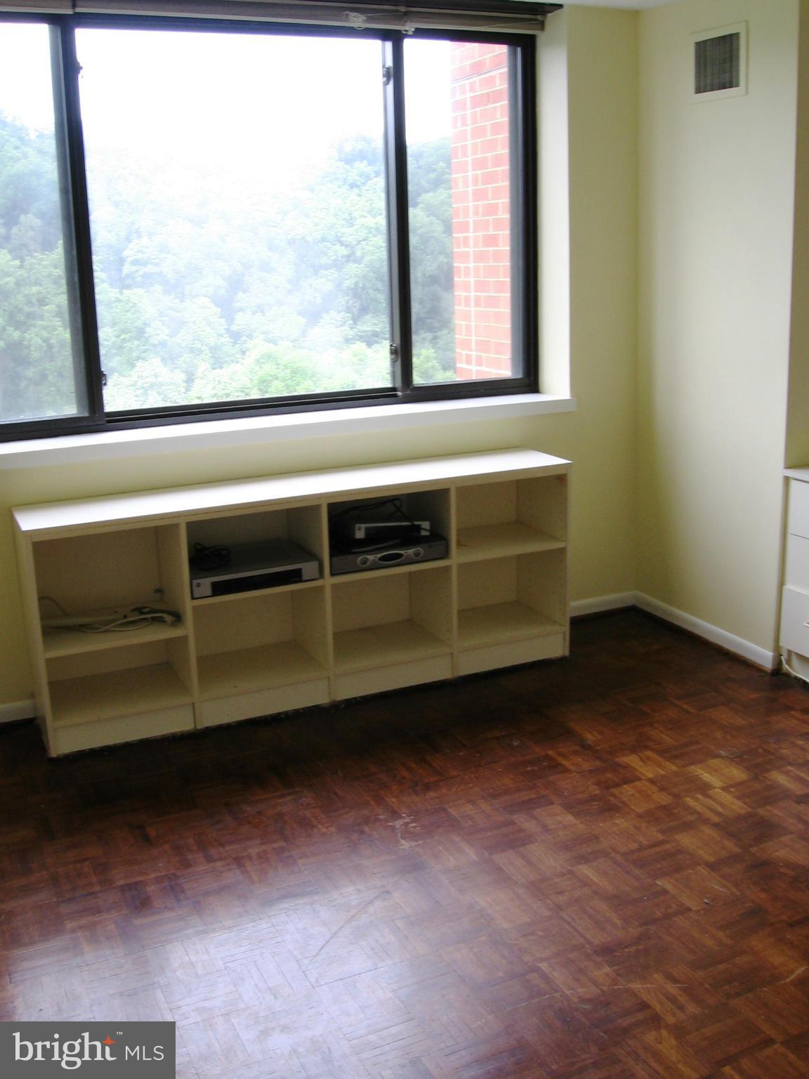 111 Hamlet Hill Road, Unit 1304 Baltimore, MD 21210 - Photo 9 of 17 a view of an empty room with a window