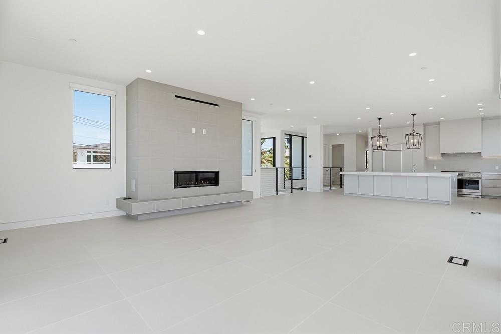 206 4th Street Encinitas, CA 92024 - Photo 13 of 64 a living room with furniture and a fireplace