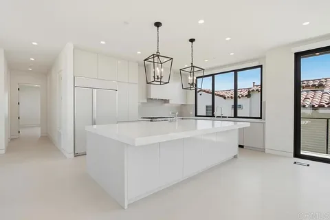a view of a livingroom with a furniture and floor to ceiling window