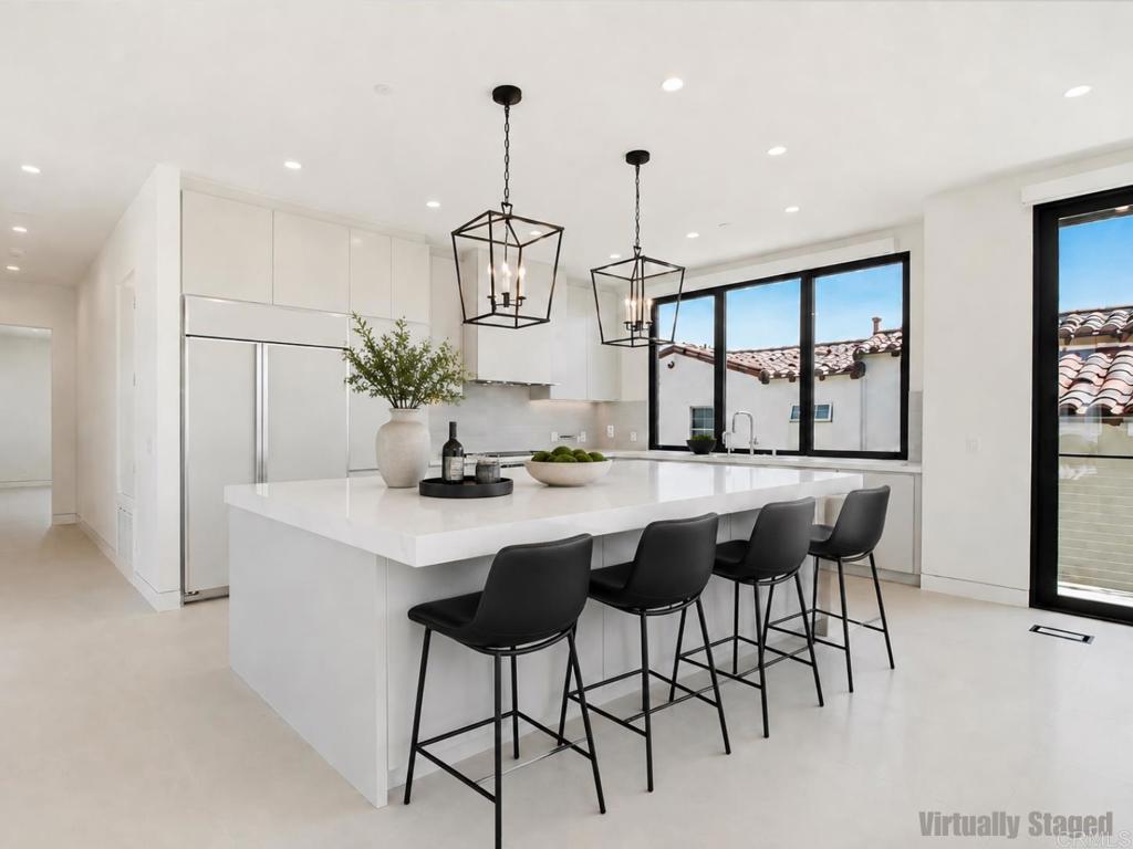 206 4th Street Encinitas, CA 92024 - Photo 18 of 64 a kitchen with a table and chairs in it