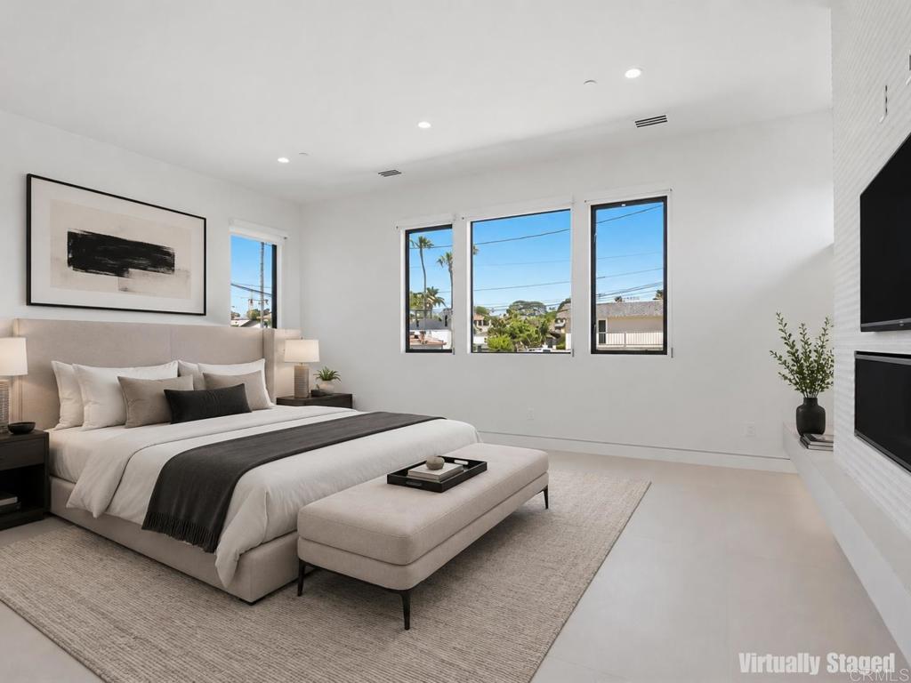 206 4th Street Encinitas, CA 92024 - Photo 27 of 64 a bedroom with a bed and a flat screen tv