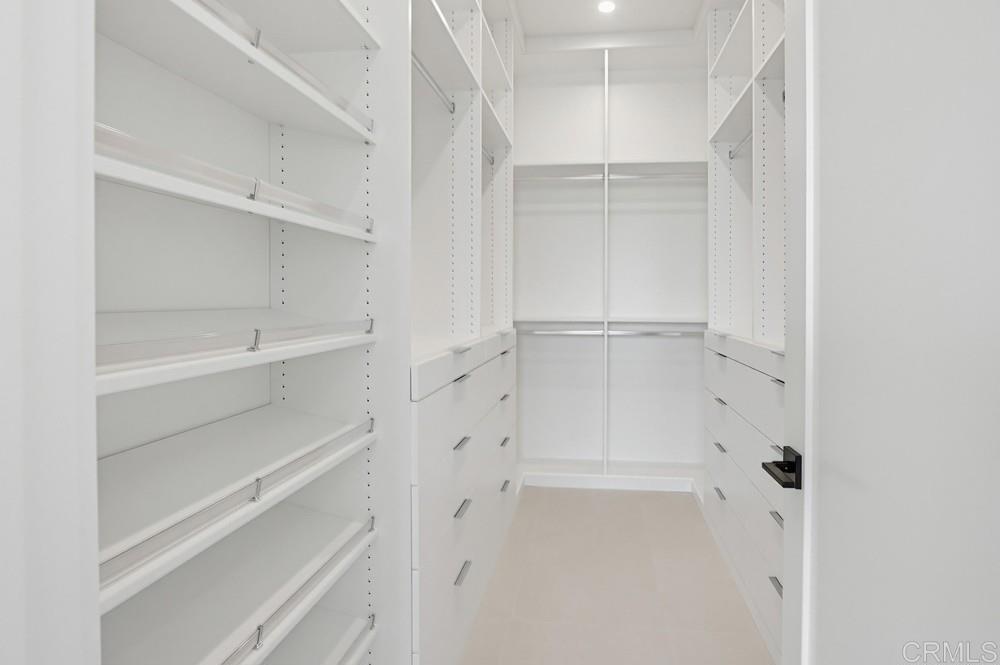206 4th Street Encinitas, CA 92024 - Photo 30 of 64 a view of walk in closet with empty racks