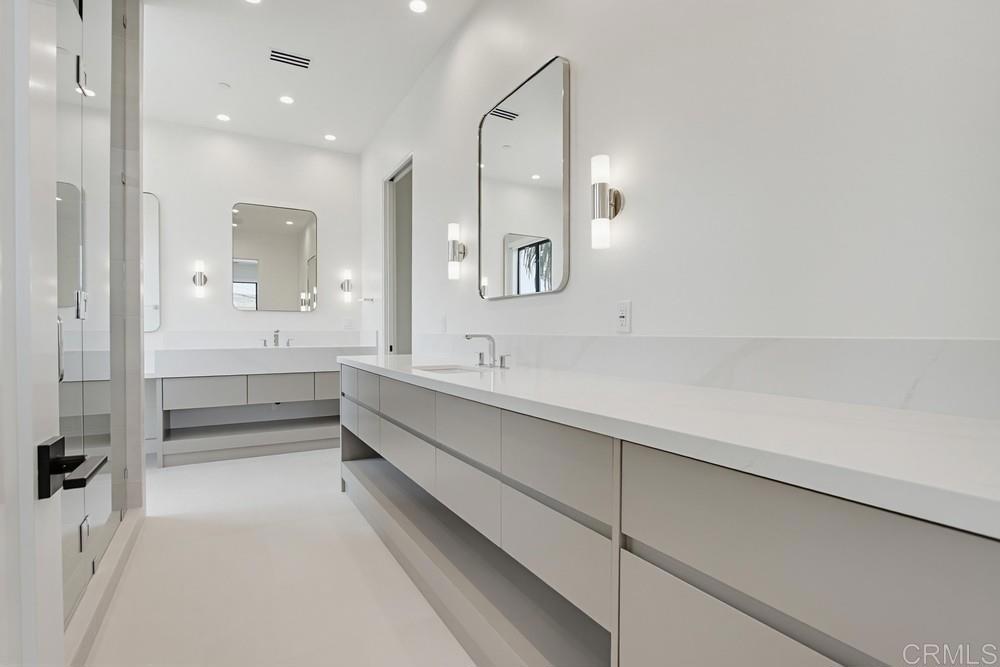 206 4th Street Encinitas, CA 92024 - Photo 31 of 64 a bathroom with a double vanity sink mirror double and bathtub