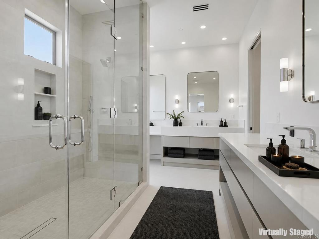 206 4th Street Encinitas, CA 92024 - Photo 33 of 64 a bathroom with a double vanity sink and mirror