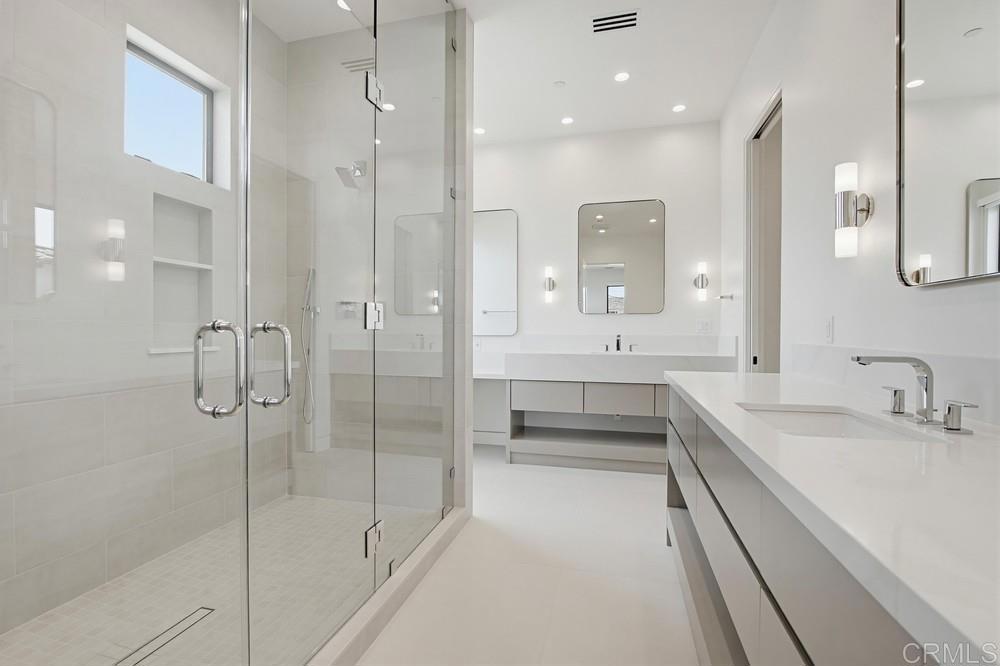206 4th Street Encinitas, CA 92024 - Photo 34 of 64 a bathroom with a double vanity sink mirror and shower