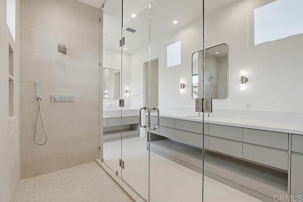 206 4th Street Encinitas, CA 92024 - Photo 36 of 64 a bathroom with a shower and a glass door