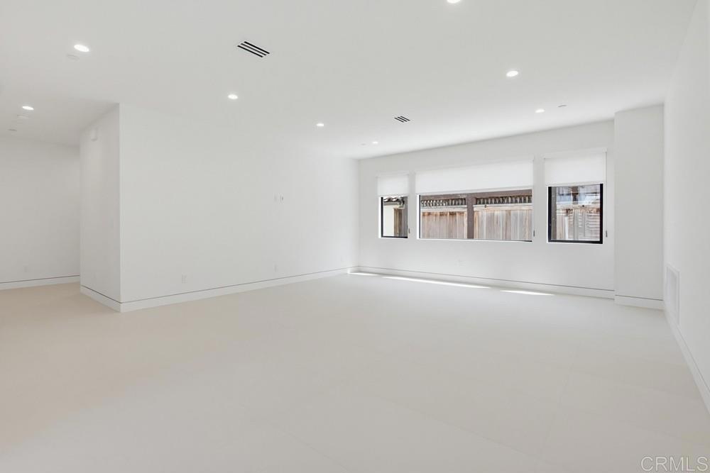 206 4th Street Encinitas, CA 92024 - Photo 41 of 64 a view of a livingroom with wooden floor and white walls