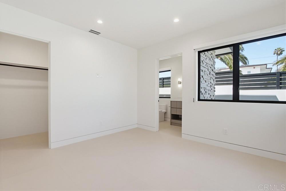 206 4th Street Encinitas, CA 92024 - Photo 43 of 64 an empty room with windows and closet