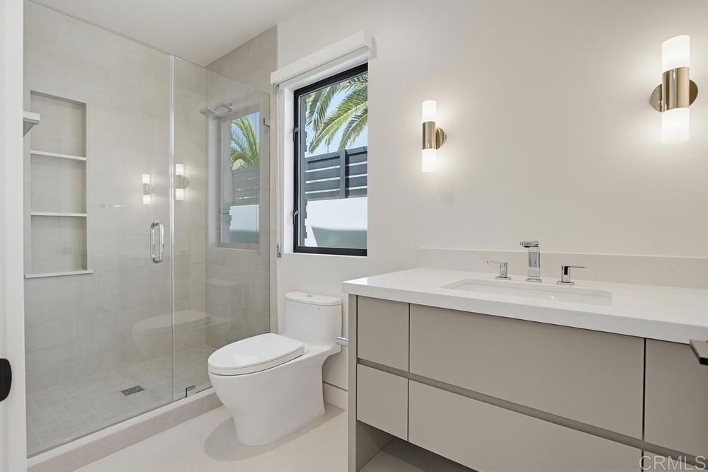 206 4th Street Encinitas, CA 92024 - Photo 45 of 64 a bathroom with a sink toilet and shower
