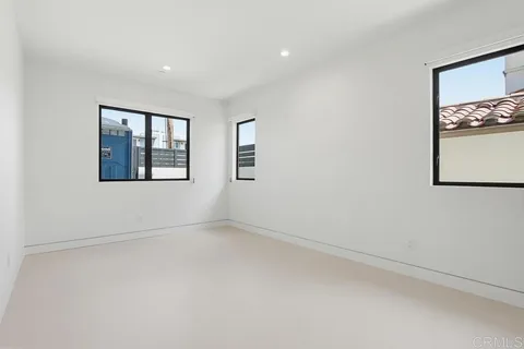 a living room with furniture and a projector