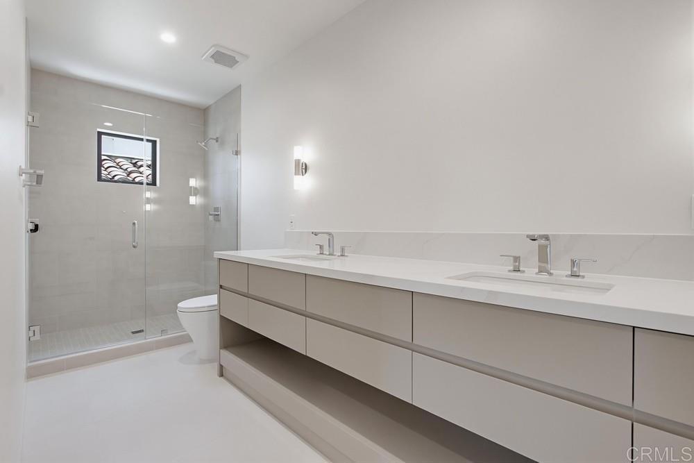 206 4th Street Encinitas, CA 92024 - Photo 49 of 64 a bathroom with a sink and a mirror