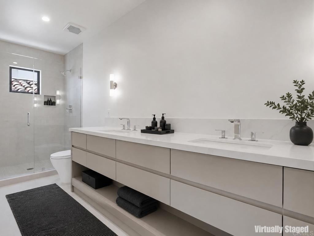 206 4th Street Encinitas, CA 92024 - Photo 50 of 64 a bathroom with a sink and a mirror