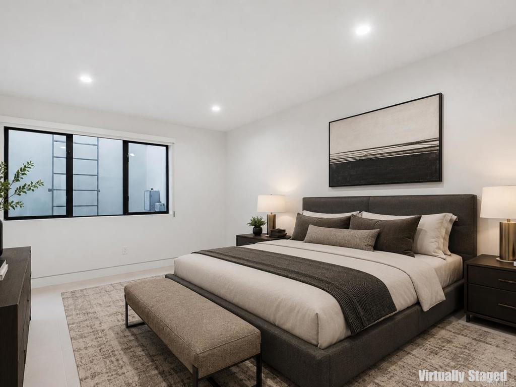 206 4th Street Encinitas, CA 92024 - Photo 52 of 64 a bedroom with a large bed and a balcony