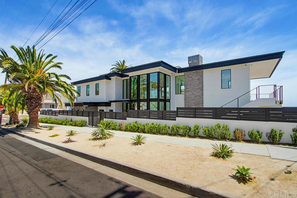 206 4th Street Encinitas, CA 92024 - Photo 63 of 64 a front view of a house with a yard