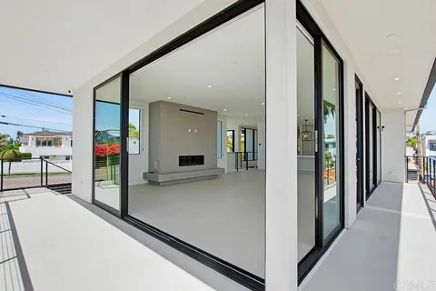 a large kitchen with stainless steel appliances granite countertop a sink a stove and a refrigerator