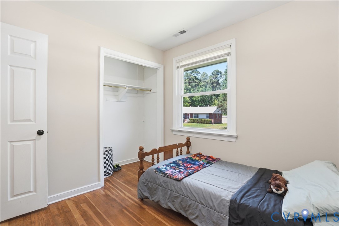 2403 Omega Road Henrico, VA 23228 - Photo 22 of 39 a bedroom with a bed and a window
