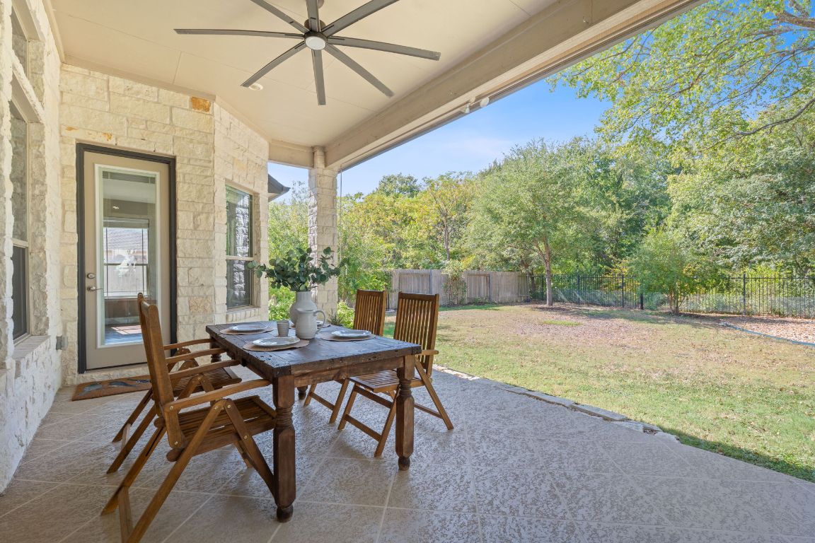 a view of a patio with a table and chairs
