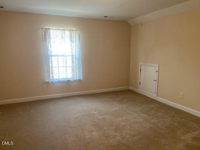 Undisclosed Address Raleigh, NC 27610 - Photo 11 of 14 an empty room with a window