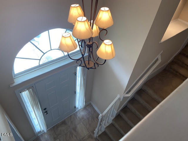 Undisclosed Address Raleigh, NC 27610 - Photo 2 of 14 a view of entryway and hall with wooden floor