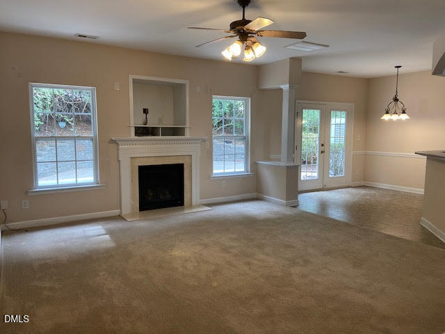 Undisclosed Address Raleigh, NC 27610 - Photo 4 of 14 a view of an empty room with a fireplace