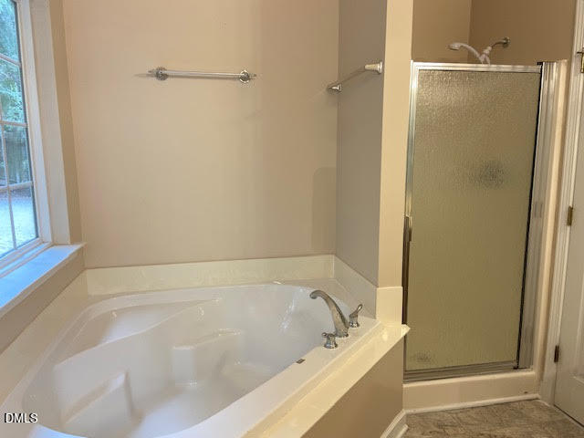 Undisclosed Address Raleigh, NC 27610 - Photo 8 of 14 a bathroom with a bathtub