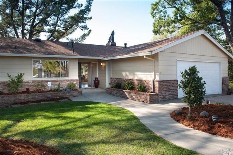 545 Bret Harte Road San Rafael, CA 94901 - Photo 1 of 1 a view of a patio with table and chairs potted plants and a large tree