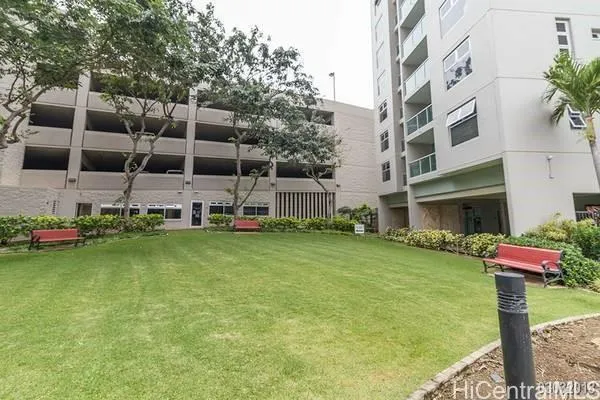 a front view of a building with garden