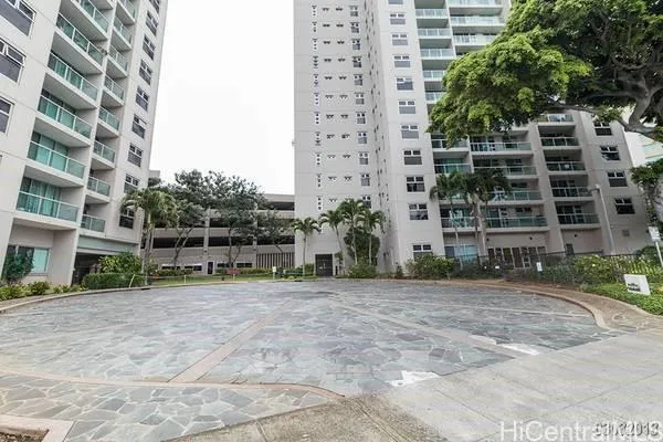 a view of a building with a yard