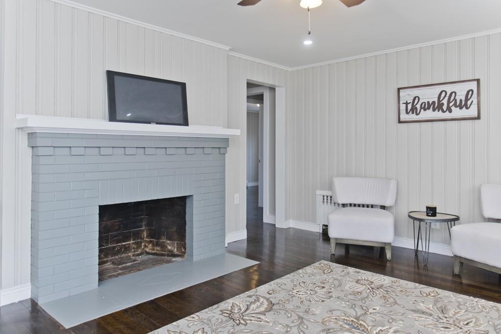 90 Darling Street Springfield, MA 01151 - Photo 17 of 42 a living room with furniture and a fireplace