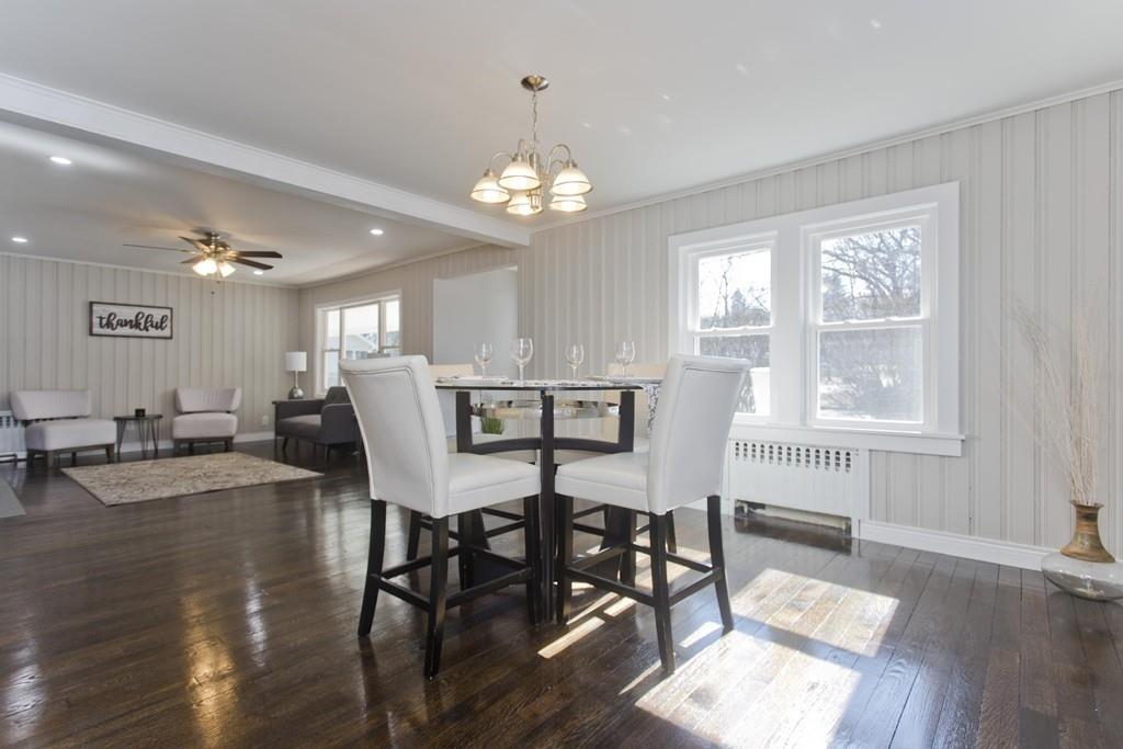 90 Darling Street Springfield, MA 01151 - Photo 22 of 42 a view of a dining room with furniture a chandelier and wooden floor