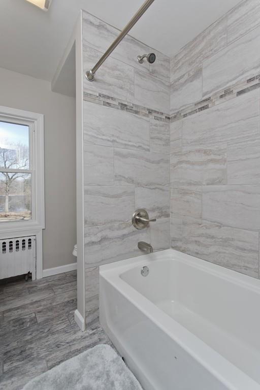 90 Darling Street Springfield, MA 01151 - Photo 28 of 42 a bathroom with a bathtub and shower