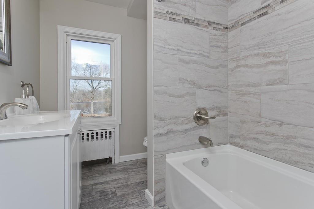 90 Darling Street Springfield, MA 01151 - Photo 29 of 42 a bathroom with a sink and a bathtub