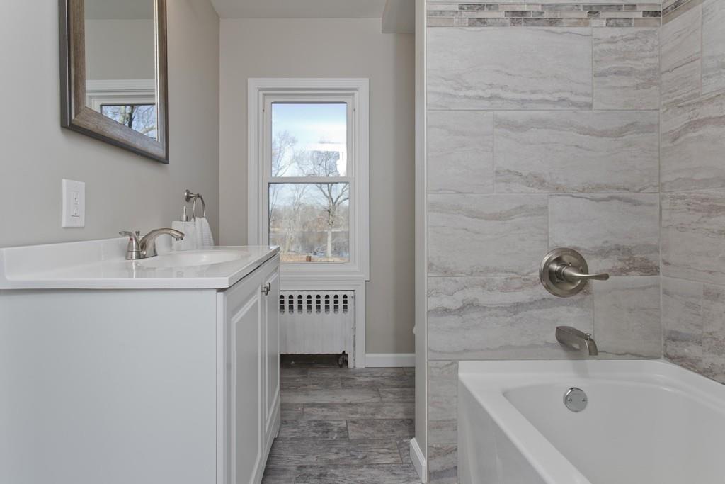 90 Darling Street Springfield, MA 01151 - Photo 31 of 42 a bathroom with a sink and a bathtub