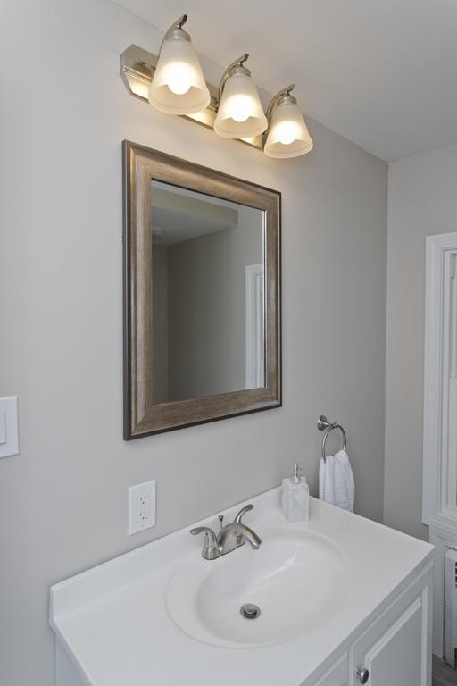 90 Darling Street Springfield, MA 01151 - Photo 32 of 42 a bathroom with a sink and a mirror