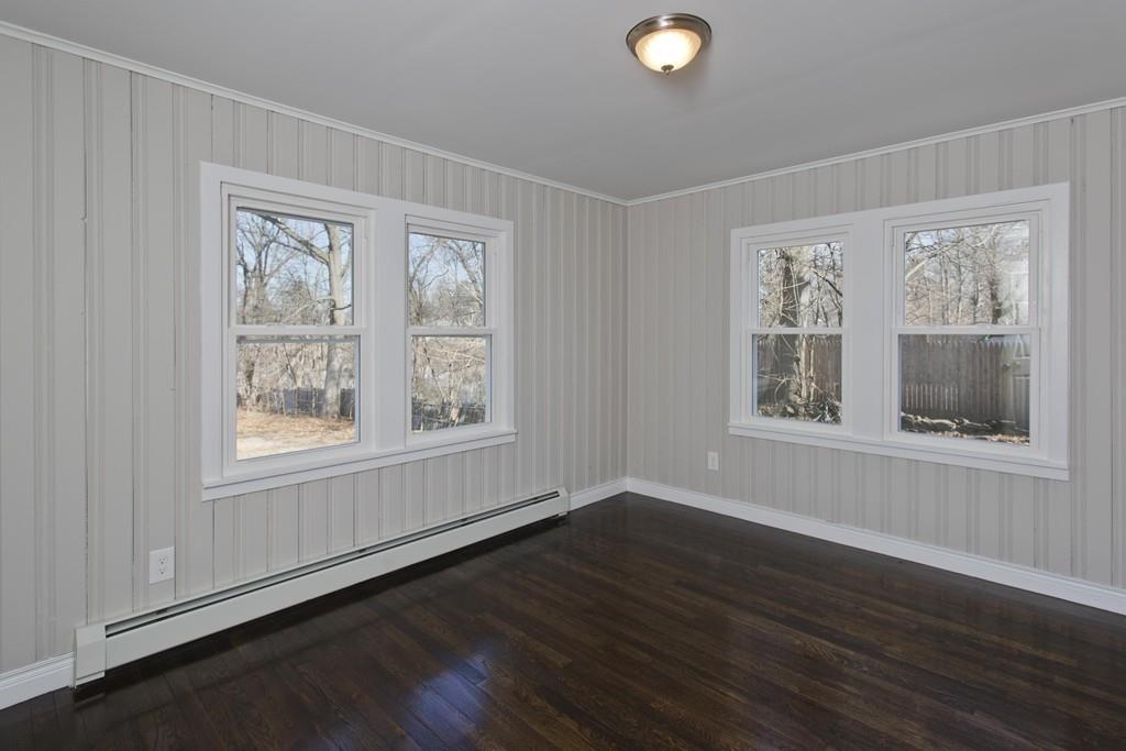 90 Darling Street Springfield, MA 01151 - Photo 33 of 42 a view of an empty room with wooden floor and a window