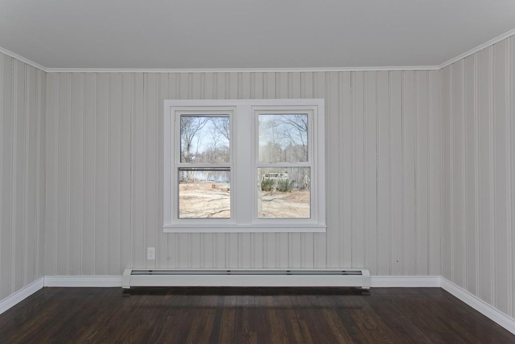90 Darling Street Springfield, MA 01151 - Photo 37 of 42 an empty room with wooden floor and windows