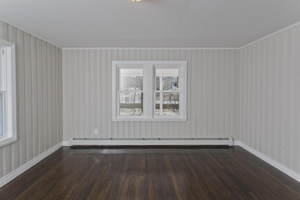 90 Darling Street Springfield, MA 01151 - Photo 40 of 42 an empty room with wooden floor and windows
