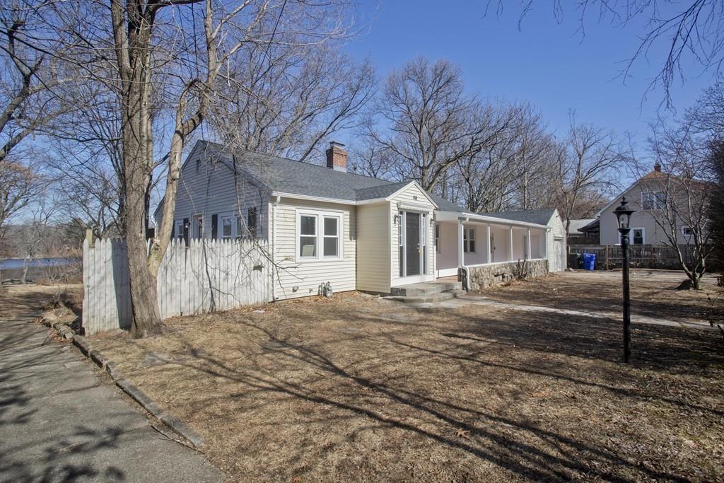 90 Darling Street Springfield, MA 01151 - Photo 41 of 42 a front view of a house with a tree