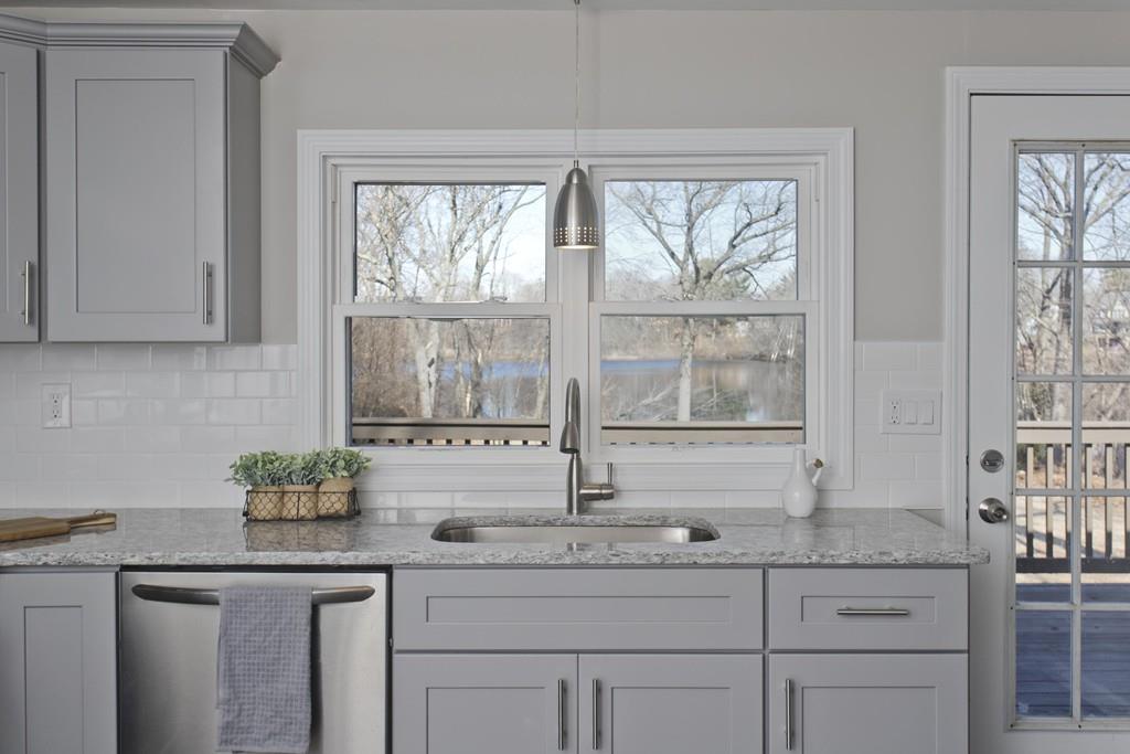 90 Darling Street Springfield, MA 01151 - Photo 5 of 42 a kitchen with granite countertop a sink and a window