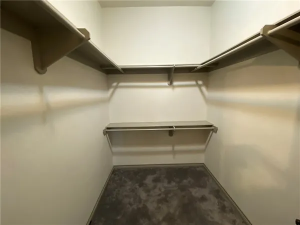 a bathroom with a granite countertop sink a toilet and bathtub