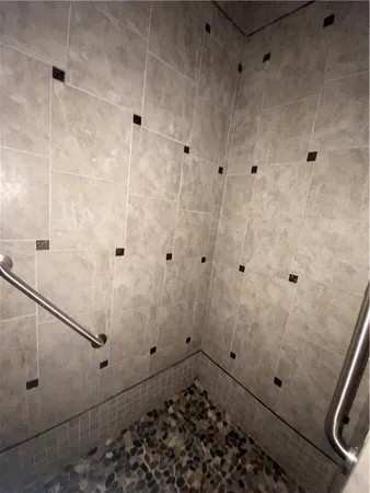 a bathroom with a tub and a shower
