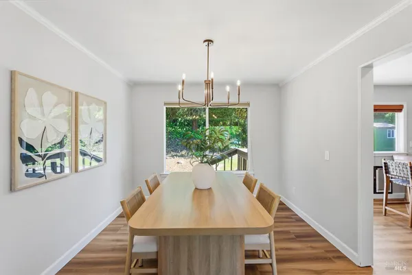a view of a dining room with furniture window and outside view