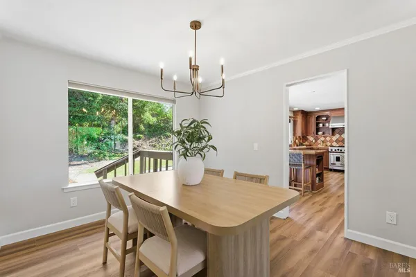 a kitchen with stainless steel appliances granite countertop wooden cabinets and a refrigerator